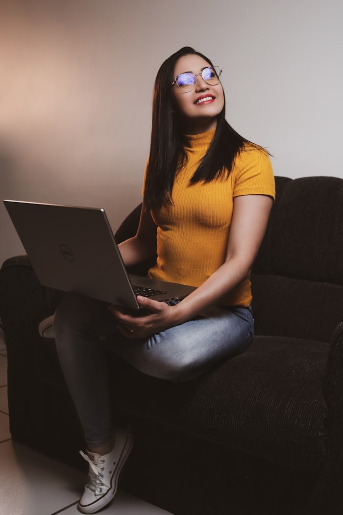 Indian student planning her study abroad application on a laptop